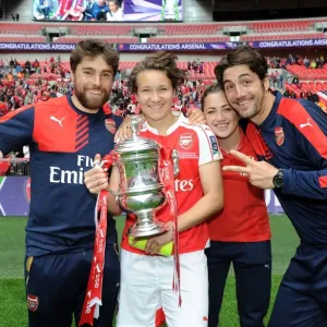 Arsenal Ladies Celebrate FA Cup Victory: Katie McCabe, Josephine Henning, and Assistant Manager Jose Elena Lift the Trophy Arsenal Ladies Celebrate FA Cup Victory: Katie McCabe, Josephine Henning, and Assistant Manager Jose Elena Lift the Trophy