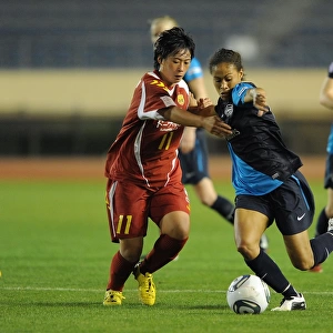 Arsenal Ladies Rachel Yankey vs. Megumi Takase: A 1-1 Draw in Charity Match between Arsenal Ladies and INAC Kobe at Nishigaoka Stadium, Tokyo (November 30, 2011)