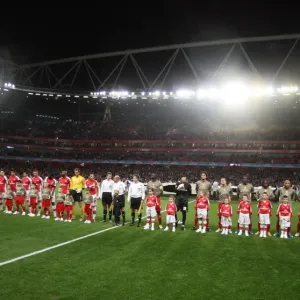 The Arsenal and Liege teams line up with their mascots