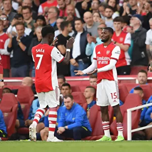 Arsenal: Maitland-Niles and Saka Celebrate Camaraderie Amidst Rivalry - Arsenal vs. Tottenham Hotspur, 2021-22 Premier League