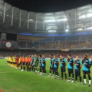 Print of The Arsenal and Malaysia team line up before the match Print of The Arsenal and Malaysia team line up before the match
