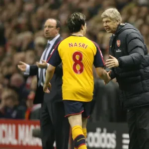 Arsenal manager Arsene talks with Samir Nasri