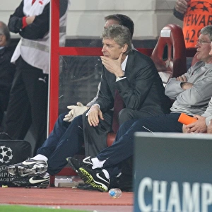Arsenal manager Arsene Wenger on the bench with assistant Pat Rice and kit man Vic Akers