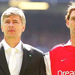 Arsenal manager Arsene Wenger with captain Tony Adams before the match