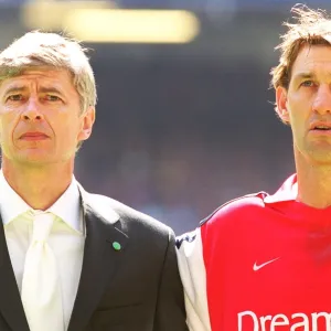 Arsenal manager Arsene Wenger with captain Tony Adams before the match