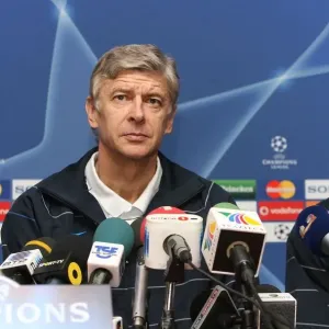 Arsenal manager Arsene Wenger and defender Johan Djourou Arsenal manager Arsene Wenger and defender Johan Djourou
