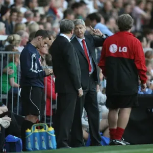 Arsenal manager Arsene Wenger and Fulham manager Roy Hodgson Arsenal manager Arsene Wenger and Fulham manager Roy Hodgson