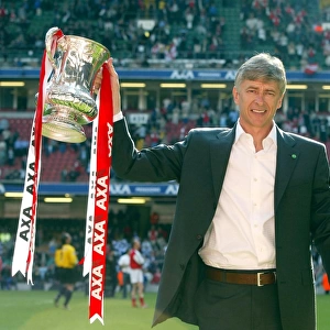 Arsenal manager Arsene Wenger lifts the FA Cup after the match
