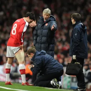 Arsenal manager Arsene Wenger looks on as Samir Nasri is treated by physio Colin Lewin Arsenal manager Arsene Wenger looks on as Samir Nasri is treated by physio Colin Lewin
