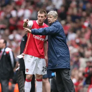 Arsenal manager Arsene Wenger with Nicklas Bendtner during the match