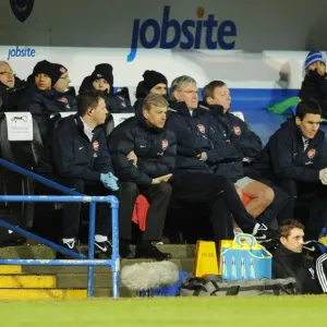 Arsenal manager Arsene Wenger with physio Colin Lewin and assistant Pat Rice during the match