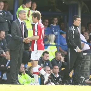 Arsenal manager Arsene Wenger shakes hands with Aaron Arsenal manager Arsene Wenger shakes hands with Aaron