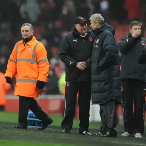Arsenal manager Arsene Wenger shakes with Orient manager Russell Slade