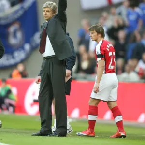 Arsenal manager Arsene Wenger with substitute Ardrey Arshavin