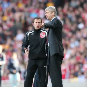 Arsenal manager Arsene Wenger talks with the 4th Official Arsenal manager Arsene Wenger talks with the 4th Official