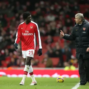 Arsenal manager Arsene Wenger talks with Emmanuel Adebayor Arsenal manager Arsene Wenger talks with Emmanuel Adebayor