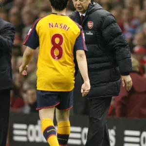 Arsenal manager Arsene Wenger talks with Samir Nasri