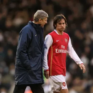 Arsenal manager Arsene Wenger talks with Tomas Rosicky at half time Arsenal manager Arsene Wenger talks with Tomas Rosicky at half time