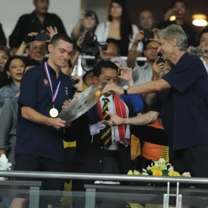 Arsenal manager Arsene Wenger and Thomas Vermaelen with the Malaysian Prime Minister Arsenal manager Arsene Wenger and Thomas Vermaelen with the Malaysian Prime Minister