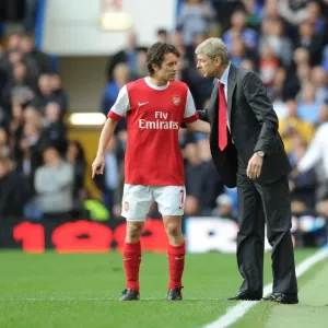 Arsenal manager Arsene Wenger with Tomas Rosicky. Chelsea 2: 0 Arsenal, Barclays Premier League Arsenal manager Arsene Wenger with Tomas Rosicky. Chelsea 2: 0 Arsenal, Barclays Premier League