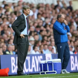 Arsenal manager Arsene Wenger and Tottenham manager Martin Jol during the match Arsenal manager Arsene Wenger and Tottenham manager Martin Jol during the match