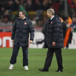 Arsenal manager Arsene Wenger & travel manager celebrate