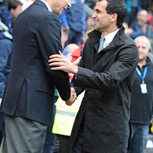 Arsenal manager Arsene Wenger with Wigan manager Roberto Martinez. Wigan Athletic 3