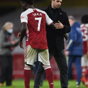 Arsenal Manager Mikel Arteta Celebrates with Bukayo Saka after Arsenal's Victory over Burnley (2020-21)