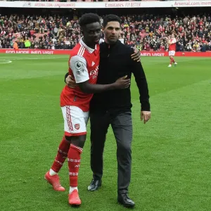 Arsenal Manager Mikel Arteta Celebrates with Bukayo Saka after Arsenal's Victory over Crystal Palace (2022-23)