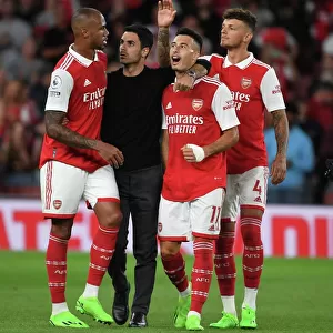 Arsenal Manager Mikel Arteta Celebrates with Gabriel, Martinelli, and White after Arsenal's Victory over Aston Villa (2022-23)