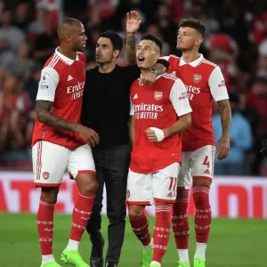 Arsenal Manager Mikel Arteta Celebrates with Gabriel, Martinelli, and White after Arsenal's Victory over Aston Villa (2022-23) Arsenal Manager Mikel Arteta Celebrates with Gabriel, Martinelli, and White after Arsenal's Victory over Aston Villa (2022-23)
