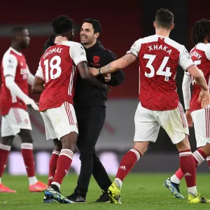 Arsenal Manager Mikel Arteta Celebrates with Thomas Partey and Granit Xhaka after Arsenal's Victory over Tottenham Hotspur (2020-21)