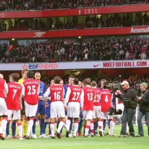 The Arsenal and Manchester United shake hands before the match The Arsenal and Manchester United shake hands before the match