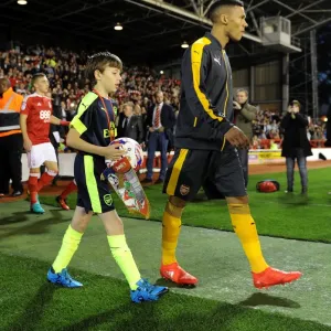 The Arsenal mascot walks out with Kieran Gibbs (Arsenal). Nottingham Forest 0: 4 Arsenal The Arsenal mascot walks out with Kieran Gibbs (Arsenal). Nottingham Forest 0: 4 Arsenal