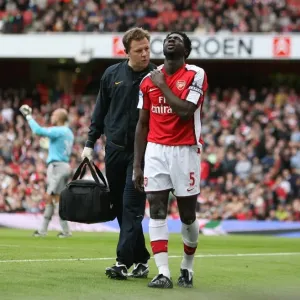 Arsenal physio Colin Lewin with injured Kolo Toure Arsenal physio Colin Lewin with injured Kolo Toure
