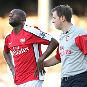 Arsenal physio Colin Lewin treats the injured William Gallas