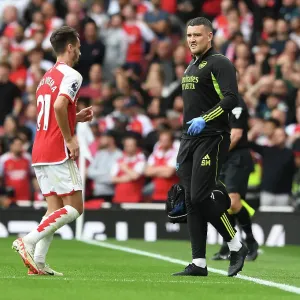 Arsenal Physio Simon Murphy Attends to Injured Player Amidst Intense Arsenal vs. Tottenham Clash (2023-24) Arsenal Physio Simon Murphy Attends to Injured Player Amidst Intense Arsenal vs. Tottenham Clash (2023-24)