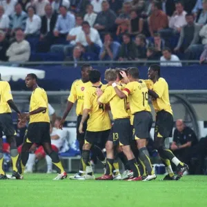 Arsenal players celebrate the 2nd goal scored by Tomas Rosicky
