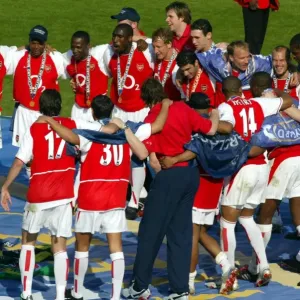 The Arsenal players celebrate at the end of the match The Arsenal players celebrate at the end of the match