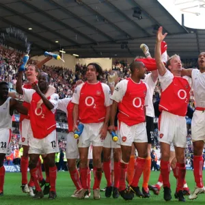 The Arsenal players celebrate at the end of the match