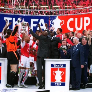 The Arsenal players celebrate lifting the FA Cup Trophy