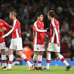 Arsenal players celebrate after the match