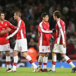 Arsenal players celebrate after the match