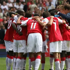 The Arsenal players celebrate after the match