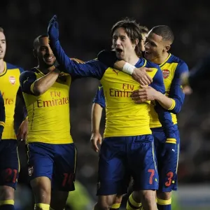 Arsenal Players Celebrate in Print