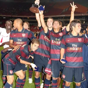 The Arsenal players celebrate winning the Amsterdam tournament The Arsenal players celebrate winning the Amsterdam tournament