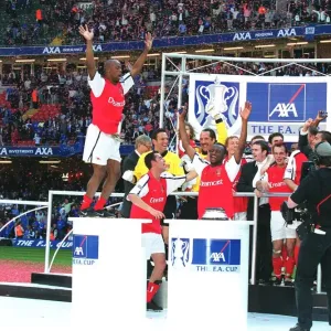 Arsenal players celebrate after winning the FA Cup Arsenal players celebrate after winning the FA Cup