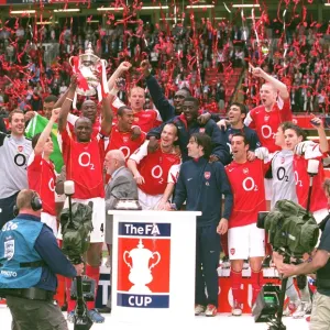 The Arsenal Players celebrate winning the FA Cup Trophy