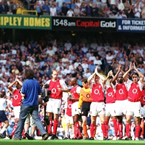The Arsenal players clap the fans before the match. Tottenham Hotspur v Arsenal
