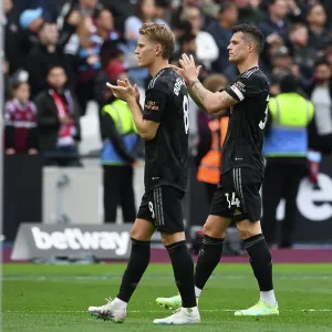 Arsenal Players Granit Xhaka and Martin Odegaard Celebrate with Fans after West Ham Victory, 2022-23 Premier League
